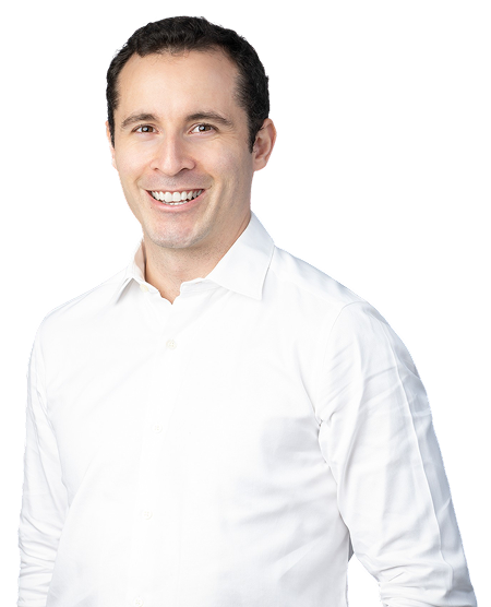 Smiling man in white shirt portrait.